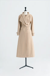 Tailored wool blend trench coat with oversized lapels and structured belted waist